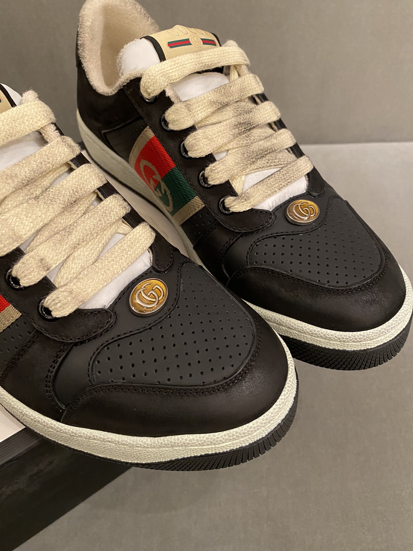 G*u*i sneakers