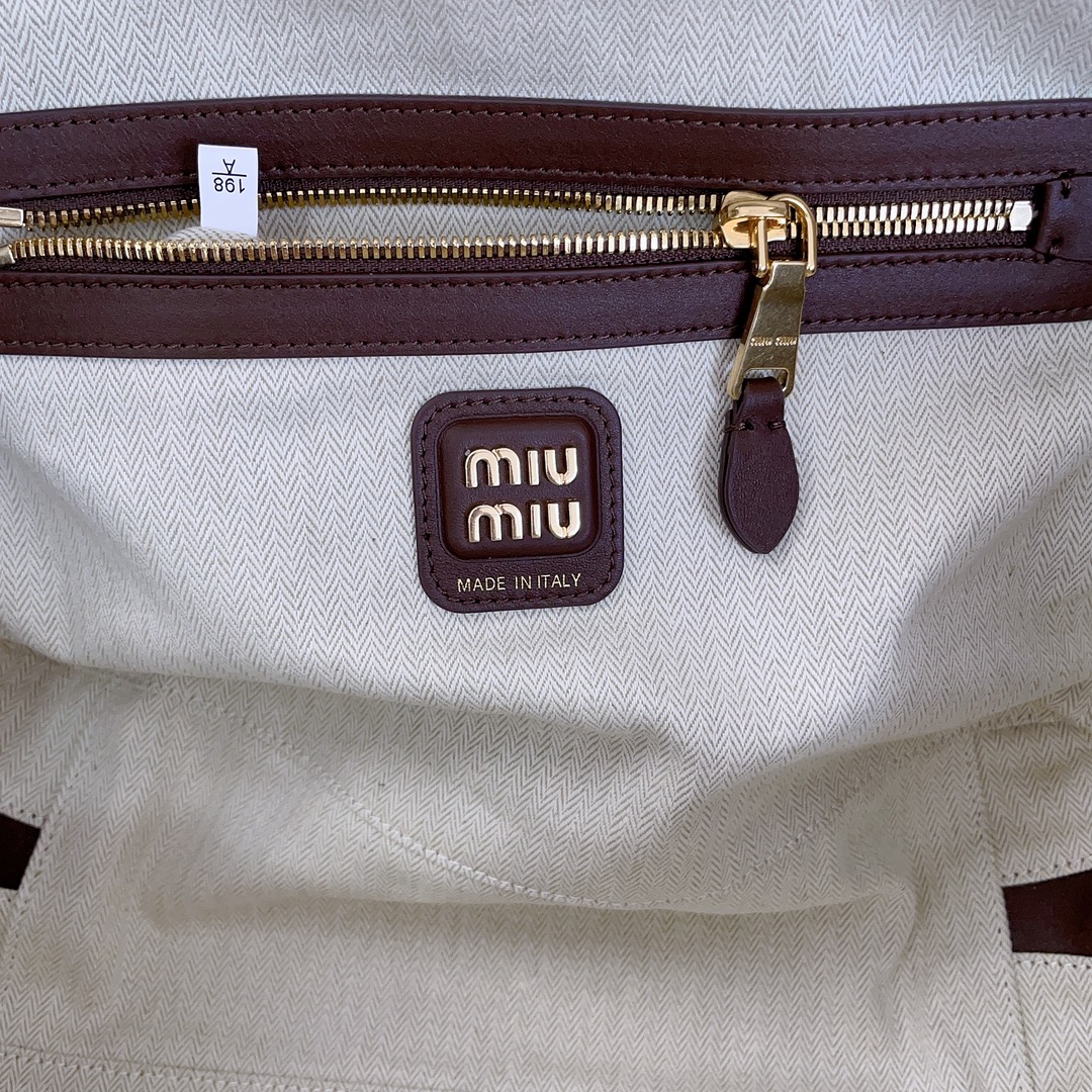 M*um*u leather top handbag-34x23x12cm